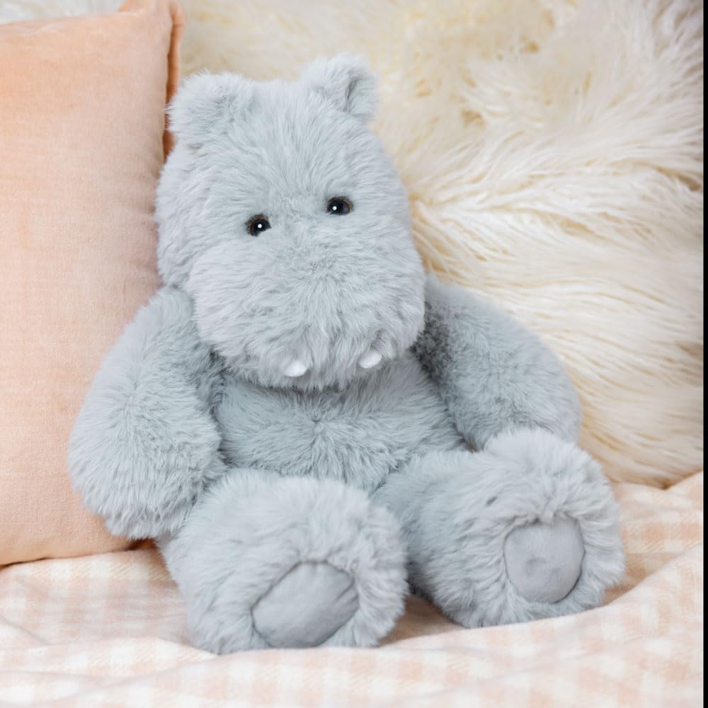 Hippo plush resting on a lap to invite snuggles.