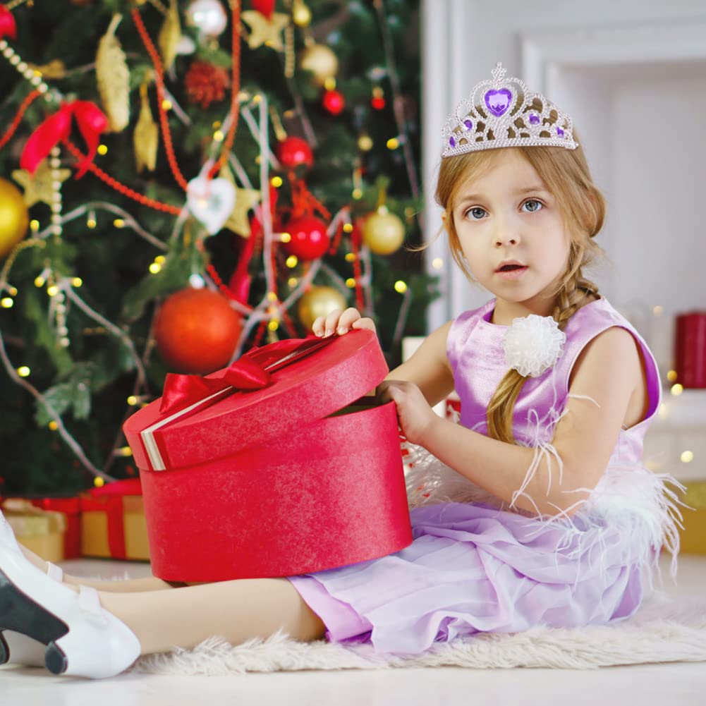 Vicloon child wearing crown during pretend play, smiling at party.