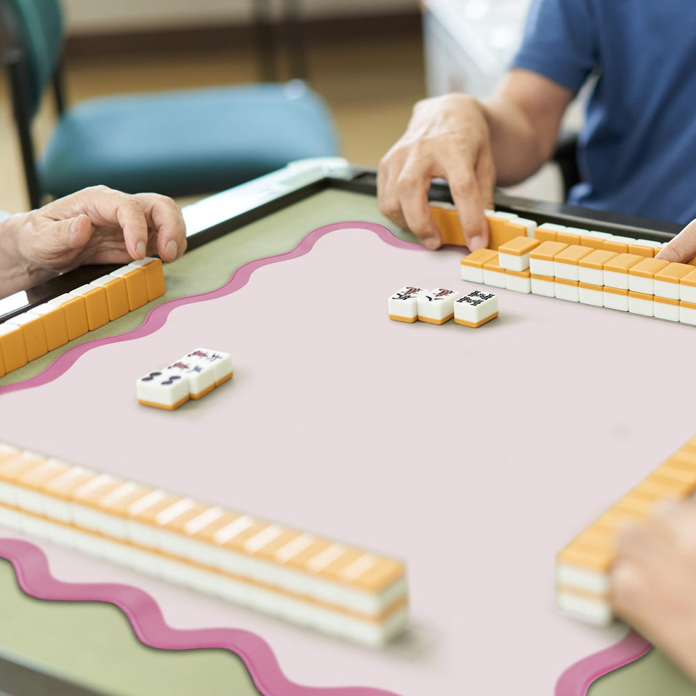Rubber material minimizes table noise during tile placement