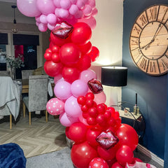 Voircoloria wedding reception decor with red balloons and ribbons