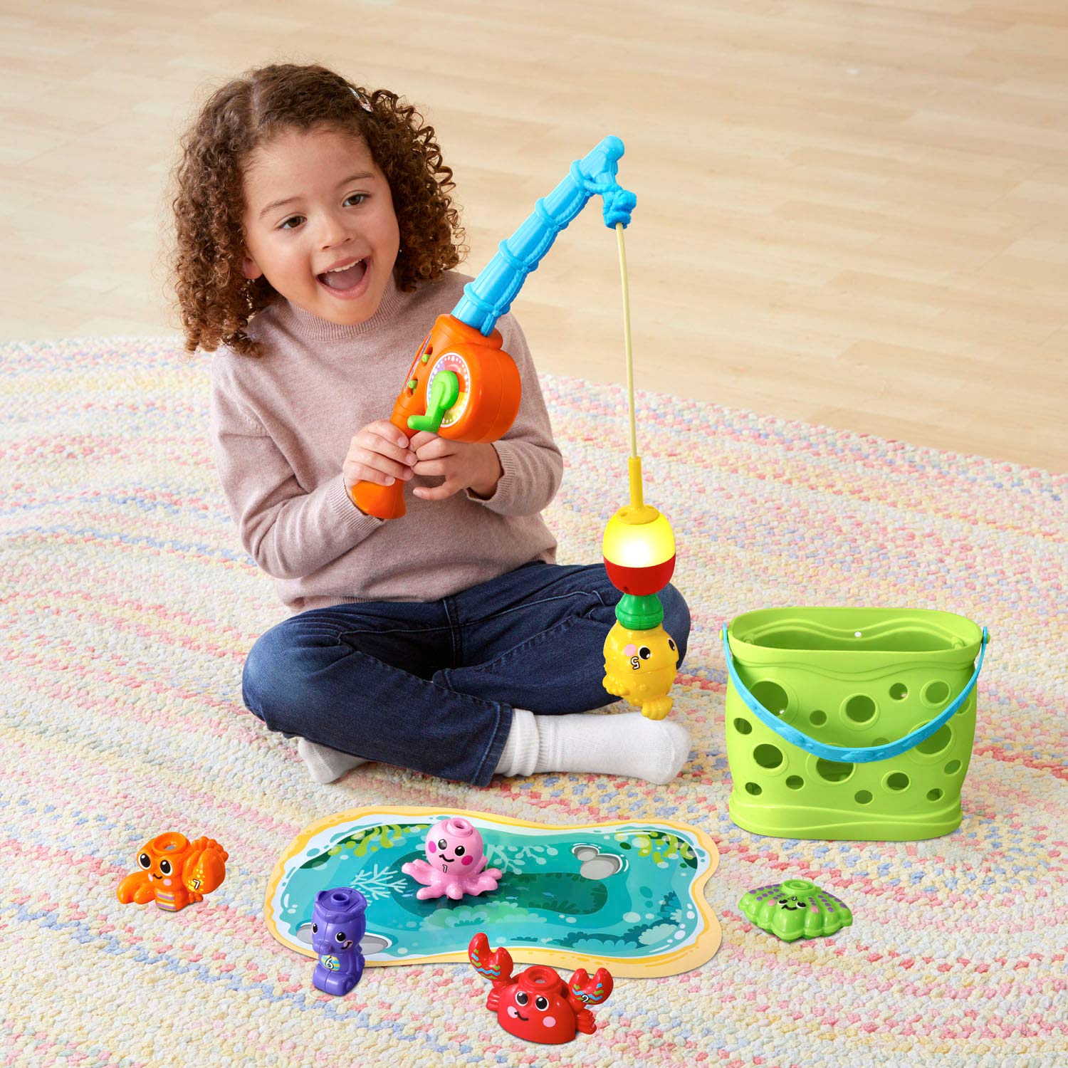 VTech Jiggle and Giggle Fishing Set lights up to match colors for learning.