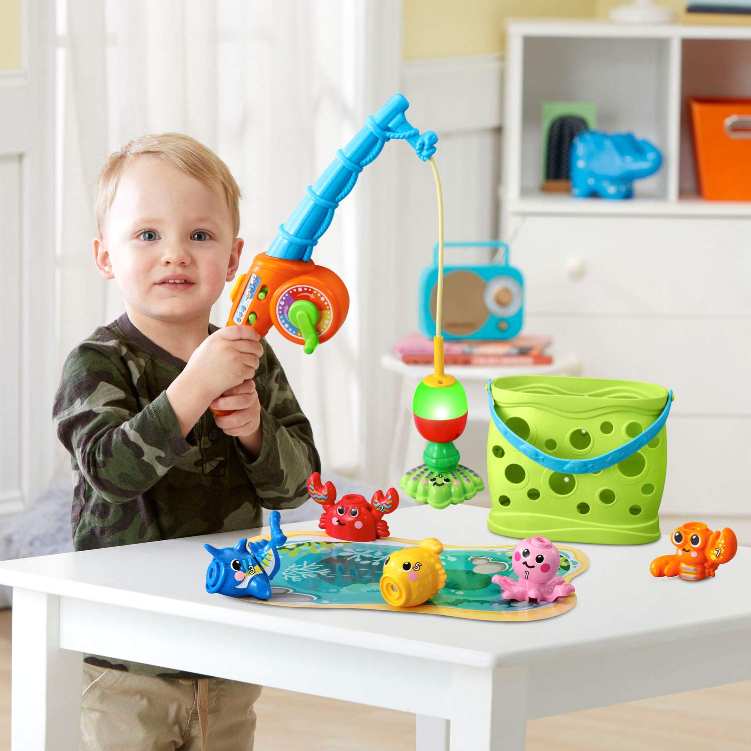 VTech Jiggle and Giggle Fishing Set stores all pieces in the included bucket after play.