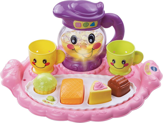 VTech Learn & Discover Pretty Party Playset pitcher lights up while kids pour pretend lemonade for imaginative play.