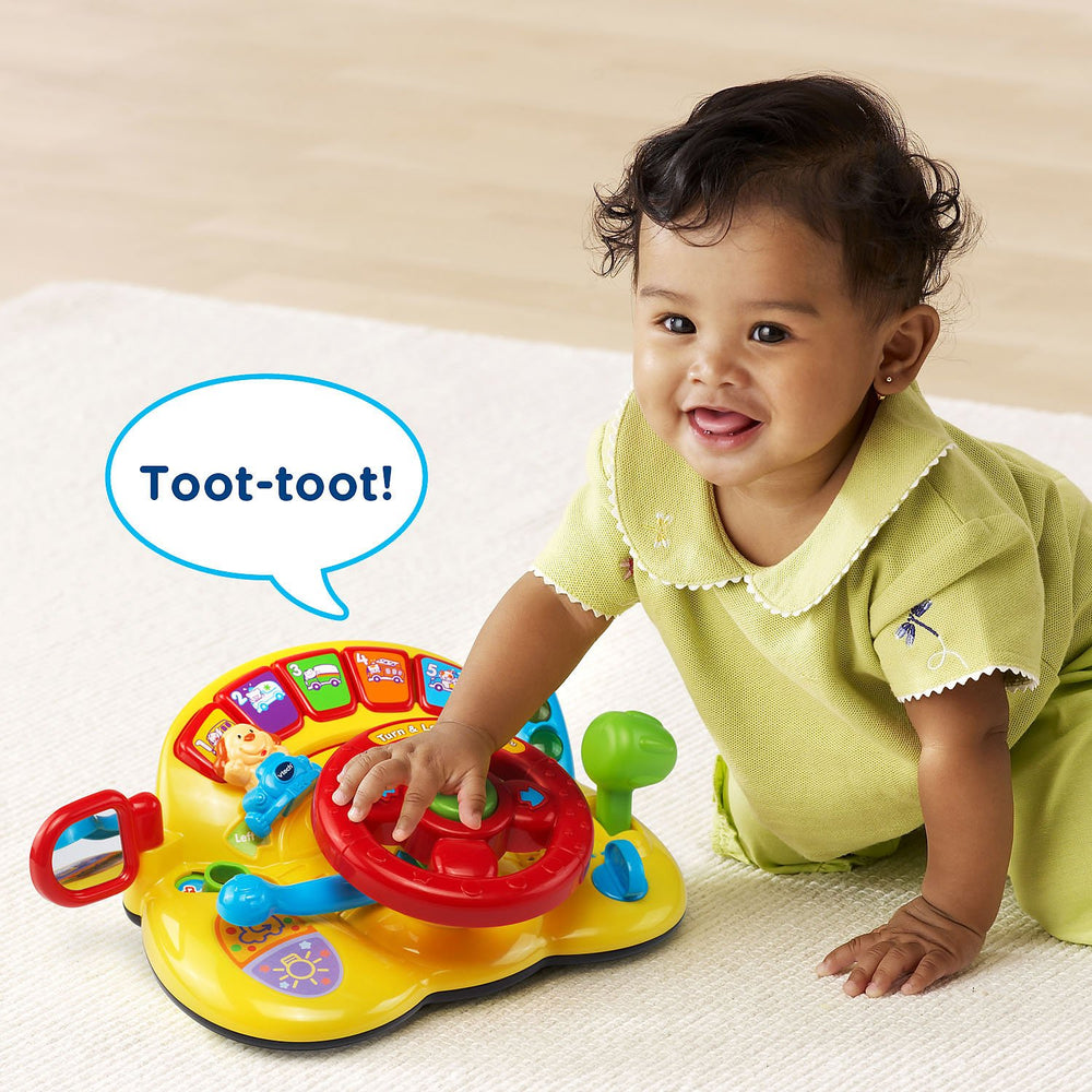 VTech Turn and Learn Driver yellow signal lever introduces directions and interactive exploration