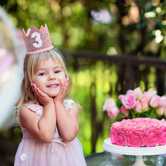 WAHAWU Rainbow Crown pink pom-pom trim adds playful detail.
