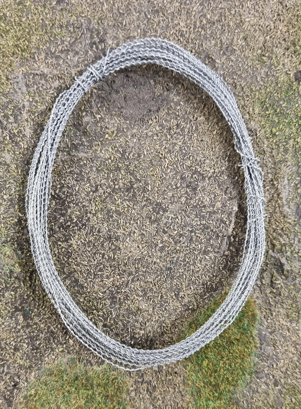 Warlord Games barbed wire 5m miniature bases ornament accentuates barricade realism on battlefield tables.