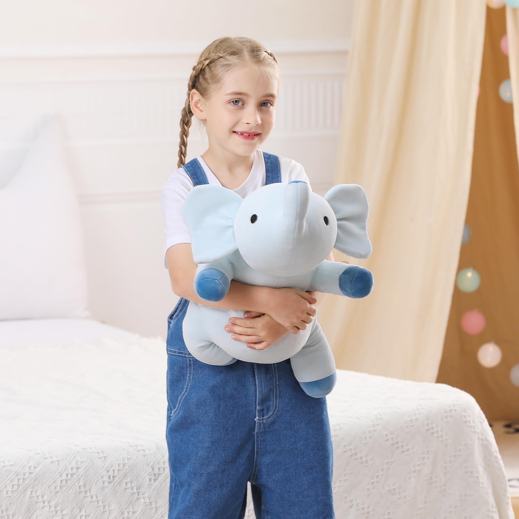 WeBingo blue weighted elephant on bed for calming rest and sleep