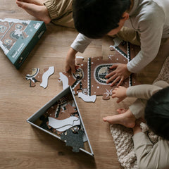 Wee Gallery gingerbread house art detail sparks imaginative, cozy play.