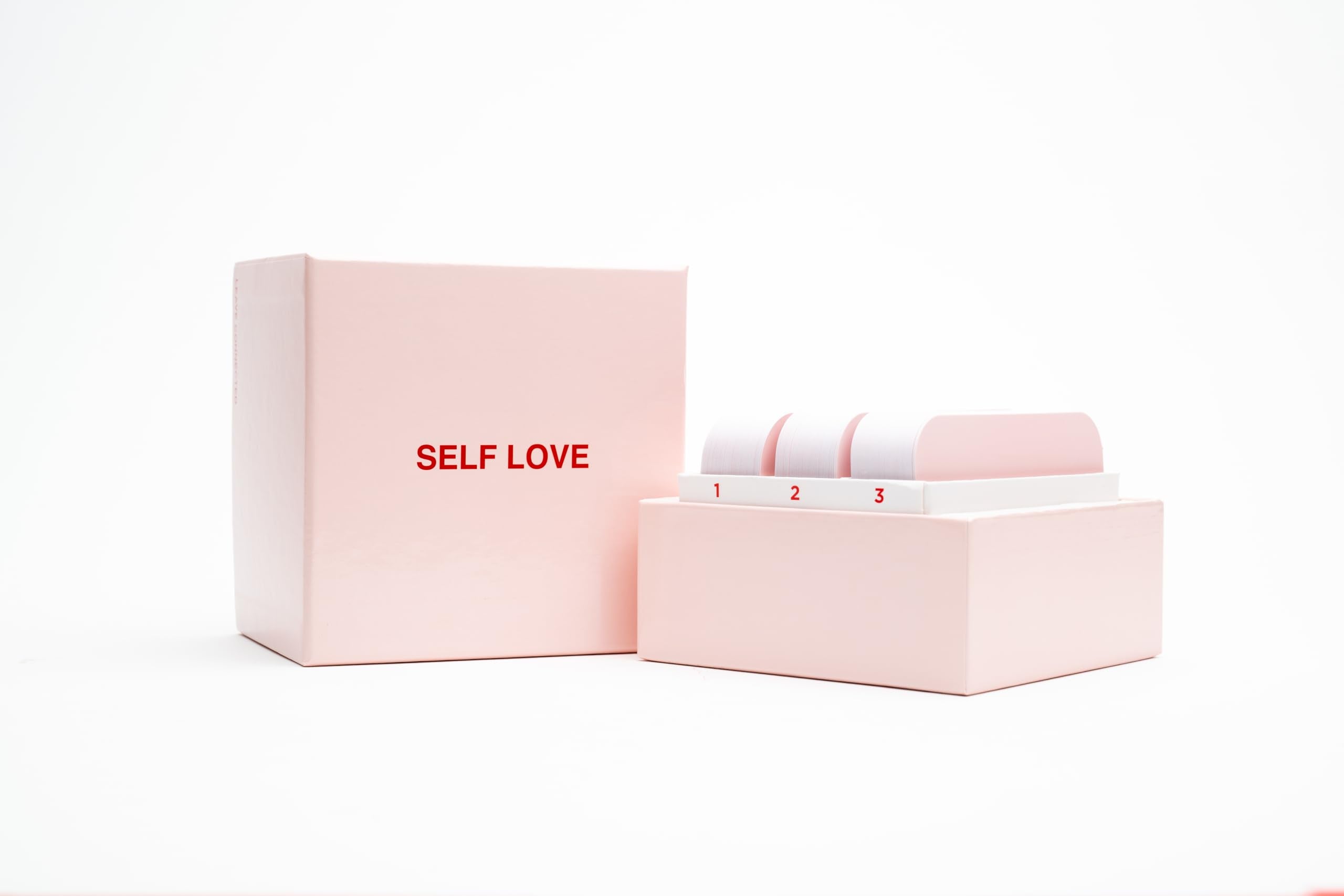 WE'RE NOT REALLY STRANGERS Self-Love Edition cozy game-night setup prompts calm dialogue.