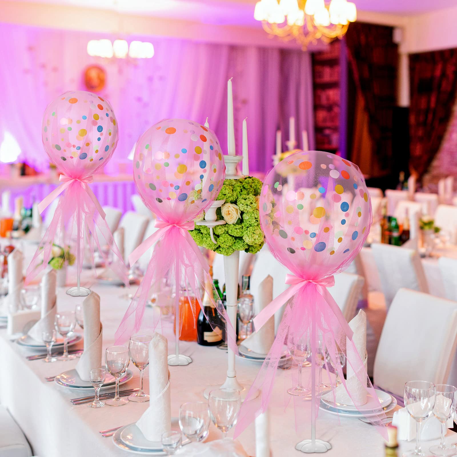 Wettarn balloon holders and pink bows add finishing charm.