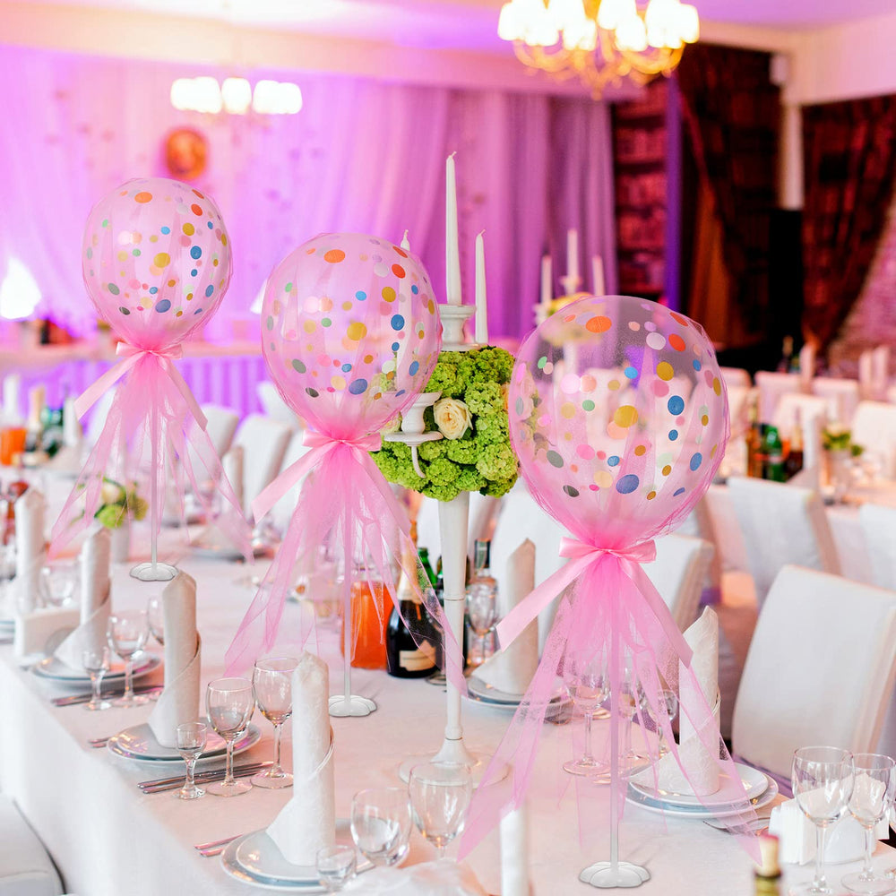Wettarn balloon holders and pink bows add finishing charm.