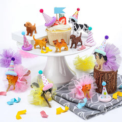 Weysat dog figurines decorate cupcakes for a pet-themed party.