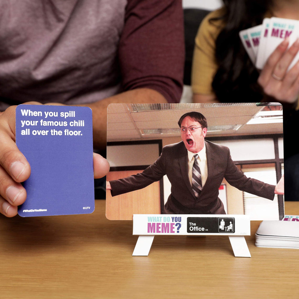 WHAT DO YOU MEME? Office Edition easel shown for displaying photo cards.