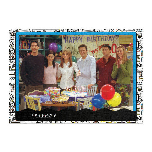 Winning Moves Friends characters around cake, ideal for group puzzle sessions.