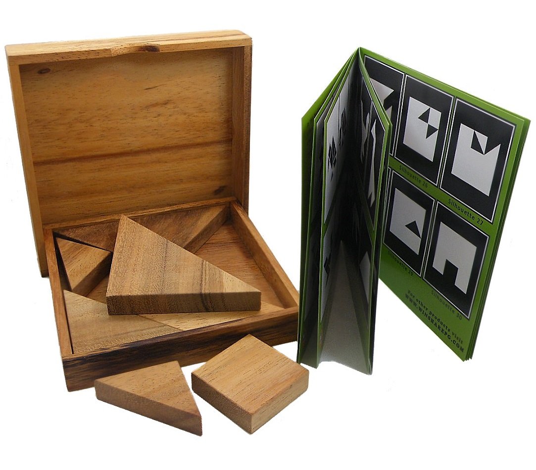 Seven tans from the Winshare Tangram laid out on a tabletop for planning.
