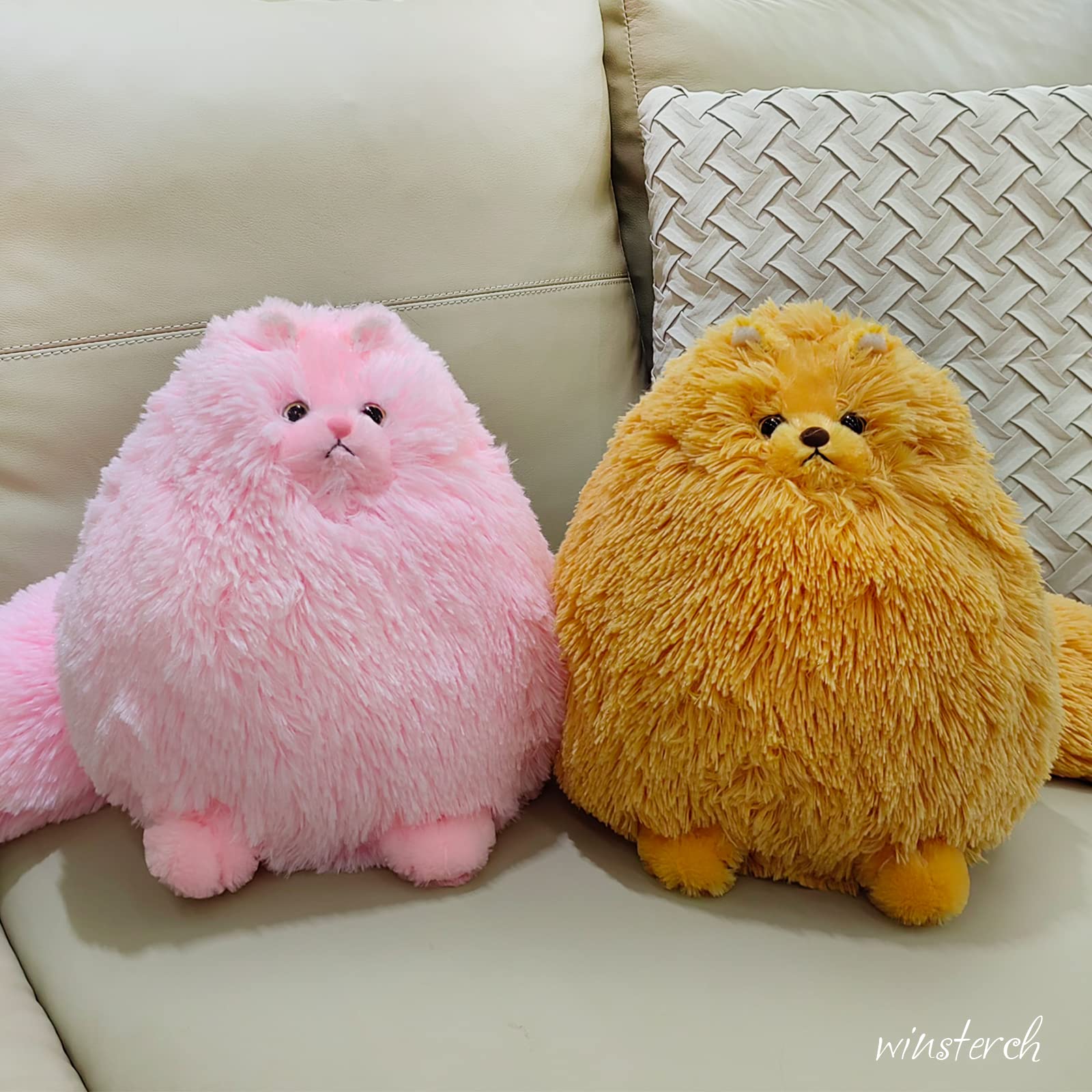Winsterch orange cat stuffed animal in hand, bedtime companion