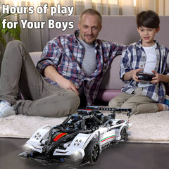 WISEPLAY RC car build action showing hands-on assembly