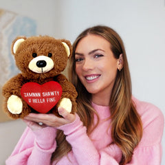Shawty bear hugging pose highlights cuddliness and warmth.