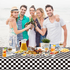 WNINK outdoor picnic setup with black and white grid tablecloth.