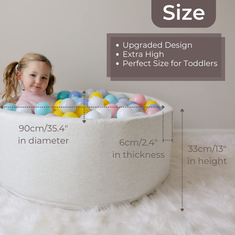 Wonder Space Deluxe ball pit in pastel colors enhances kids' room decor.