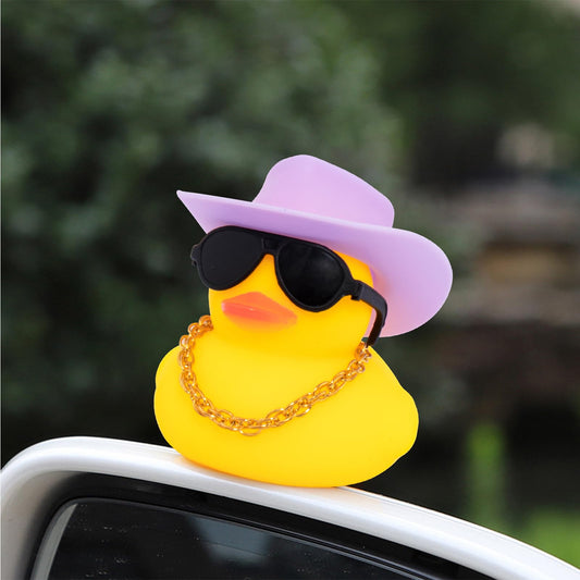 Wonuu rubber duck wearing sunglasses for chic dashboard style.