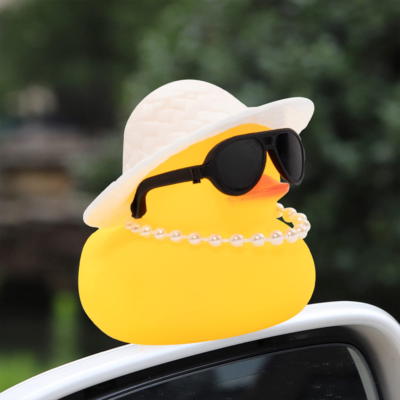 Wonuu duck wearing sunglasses adds stylish whimsy to the car interior