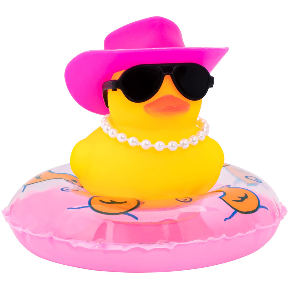 Wonuu rubber duck with sun hat on dashboard for playful car decor.