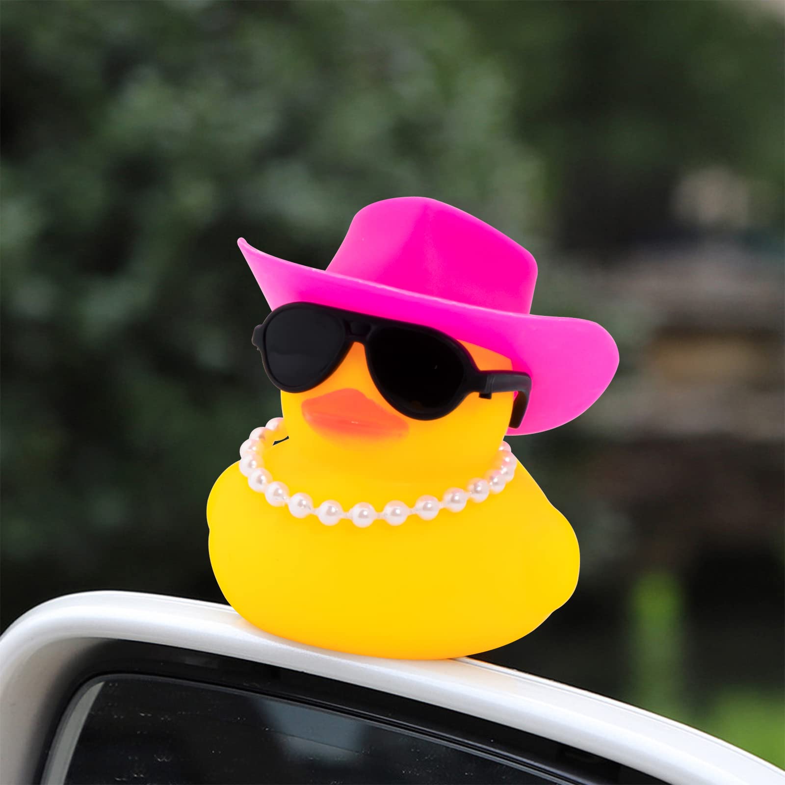 Wonuu rubber duck wearing sunglasses adds chic dashboard charm.