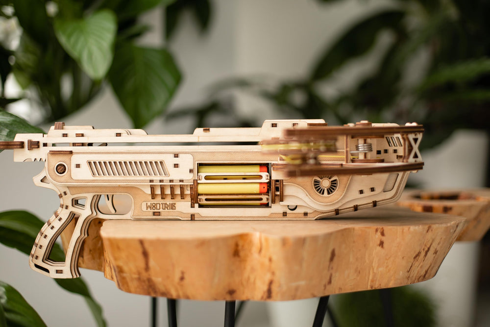 Wood Trick Bullet Boltcaster 6-bullet magazine highlights interactive reload mechanism.