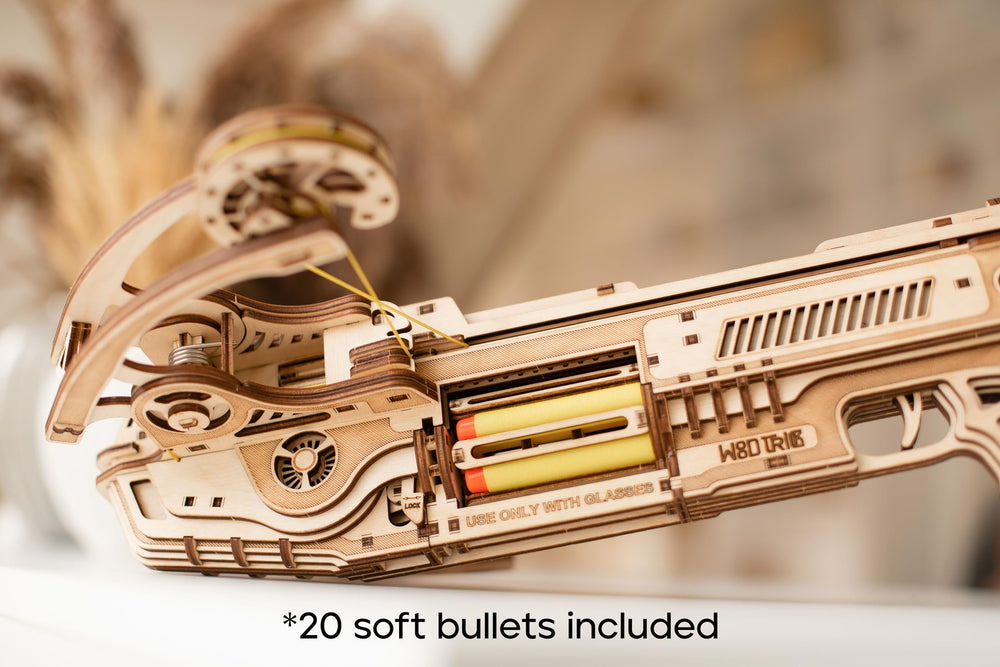 Wood Trick Bullet Boltcaster assembly process with focused hobbyists enjoying a puzzle.