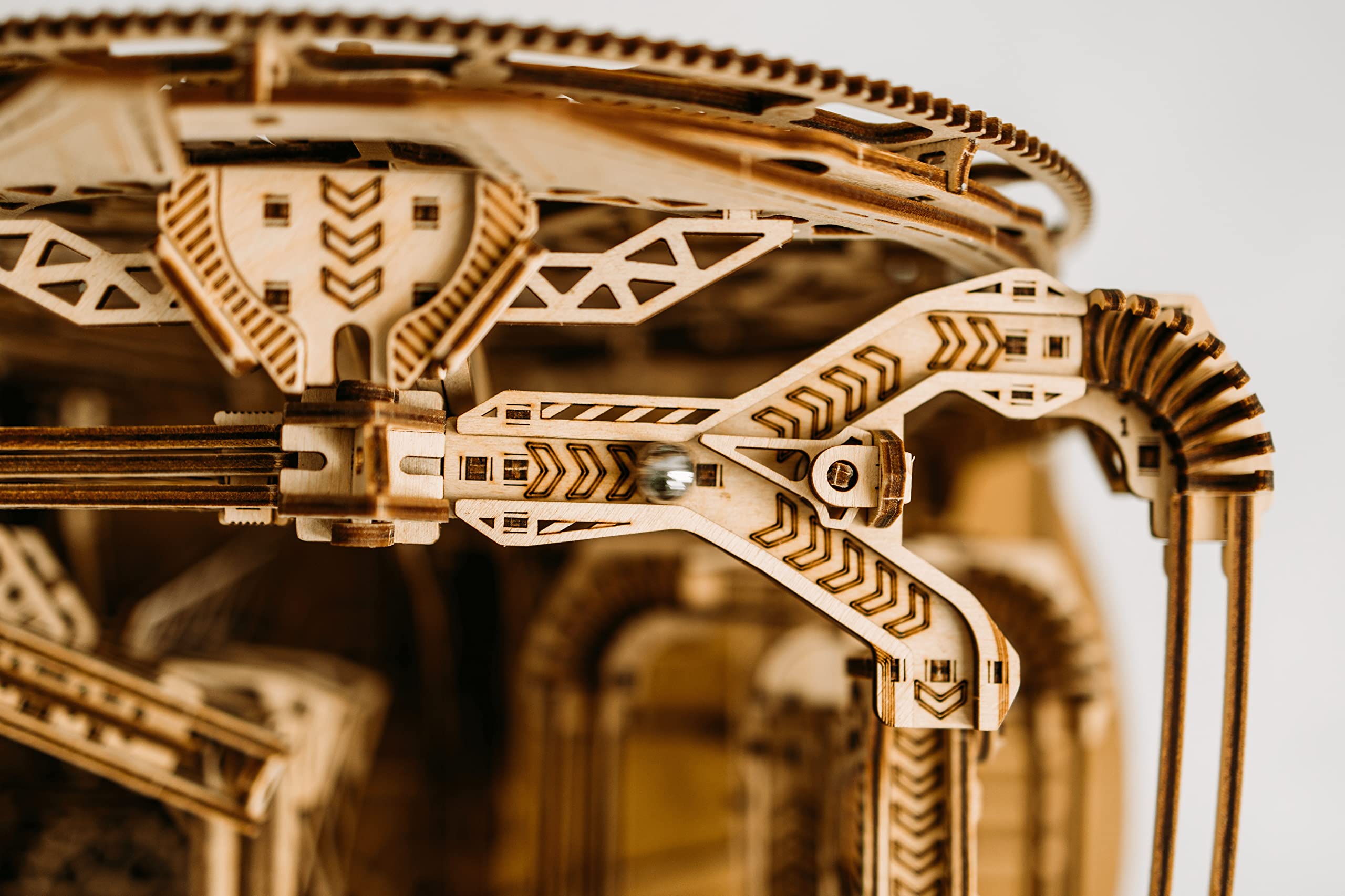 Wood Trick planetary-like puzzle in motion demonstrates engaging mechanical storytelling
