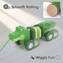 WoodenEdu crocodile pull toy baby-hands use demonstrates easy handling for little fingers.