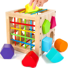 Woodmam shape sorter cube with eight shapes for hands-on learning and color recognition.