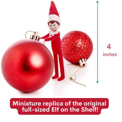 World's Smallest Elf On The Shelf tucked into a stocking scene.