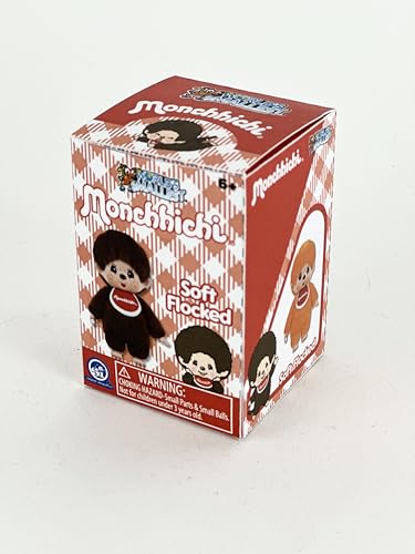 World's Smallest Monchhichi miniature shown in hand for scale and collectibility.