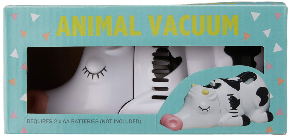 Wrapables Cow mini tabletop vacuum in use on a tidy desk.