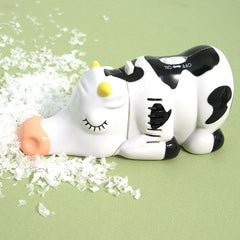 Wrapables Cow mini tabletop vacuum, side view, compact cordless cleaning on tabletops.