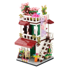 Wriyvngs Flower House exterior with vivid micro bricks on display shelf