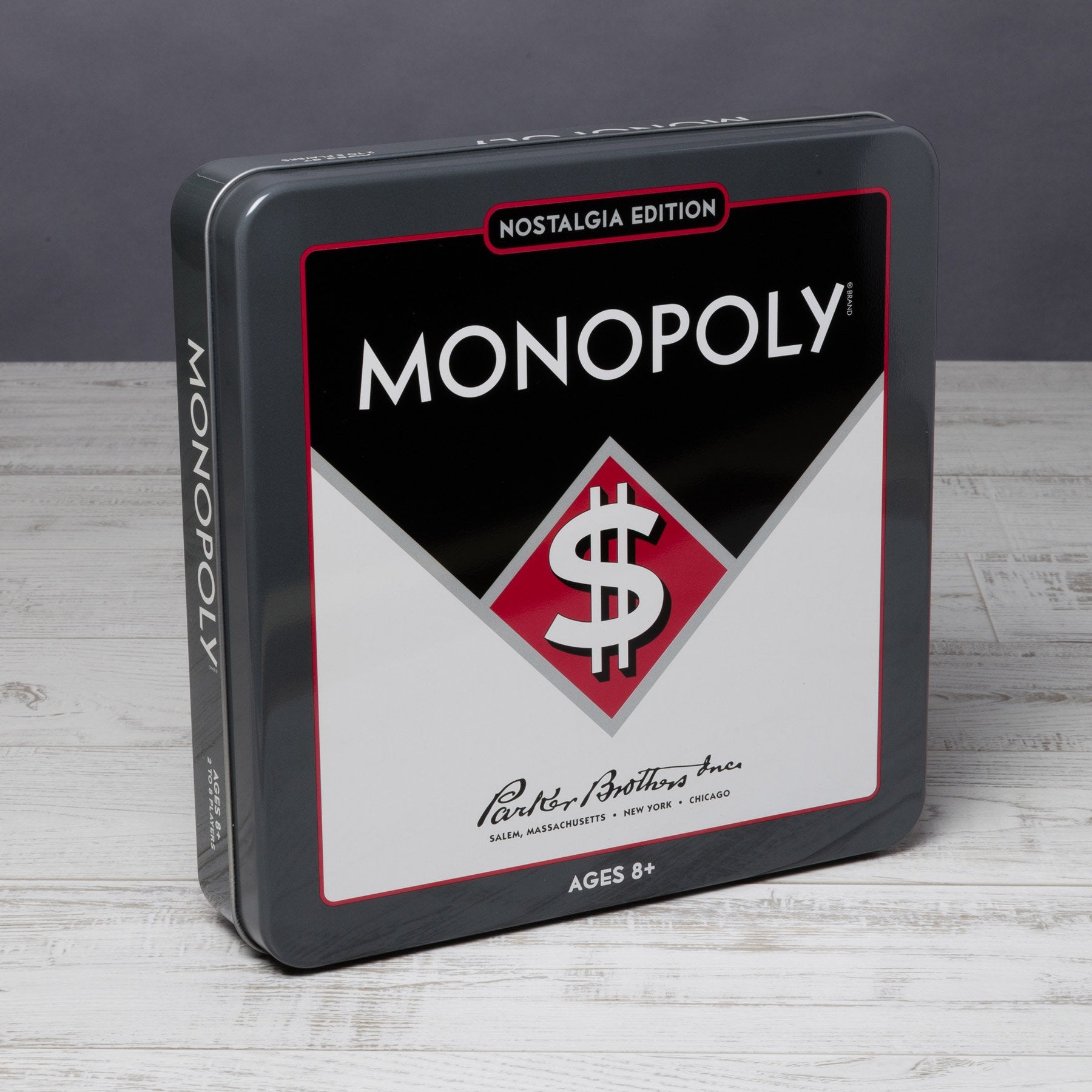 Vintage 1937-style graphics on the game board and tin.