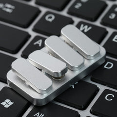 WSHWXY metal fidget slider on desk, a stylish office accessory for tactile play.