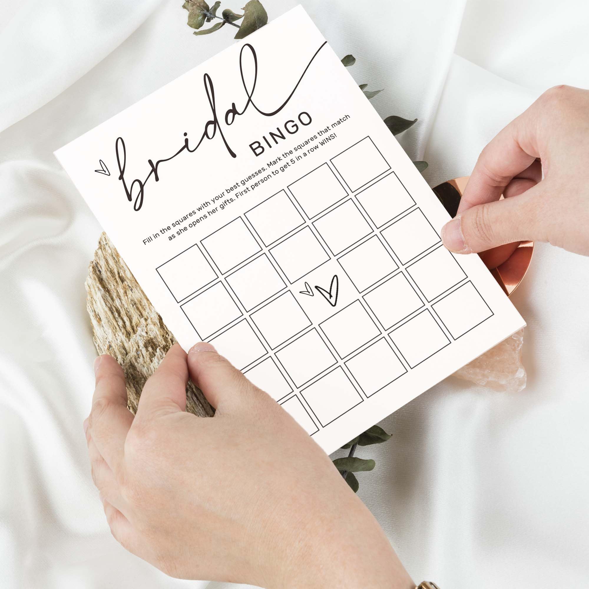 Wybgno bingo cards used as a guest book alternative at a wedding reception.