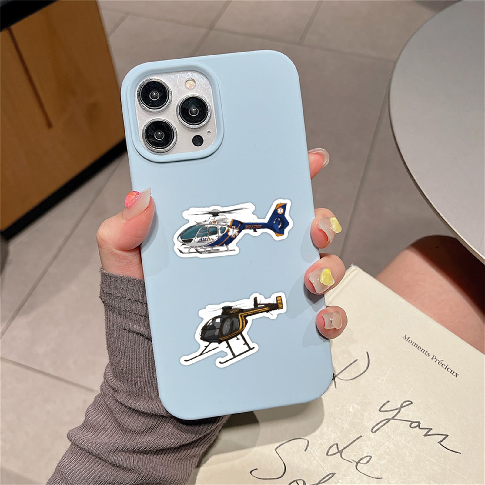 Wyyeleswm helicopter stickers on a laptop for vibrant, long-lasting design
