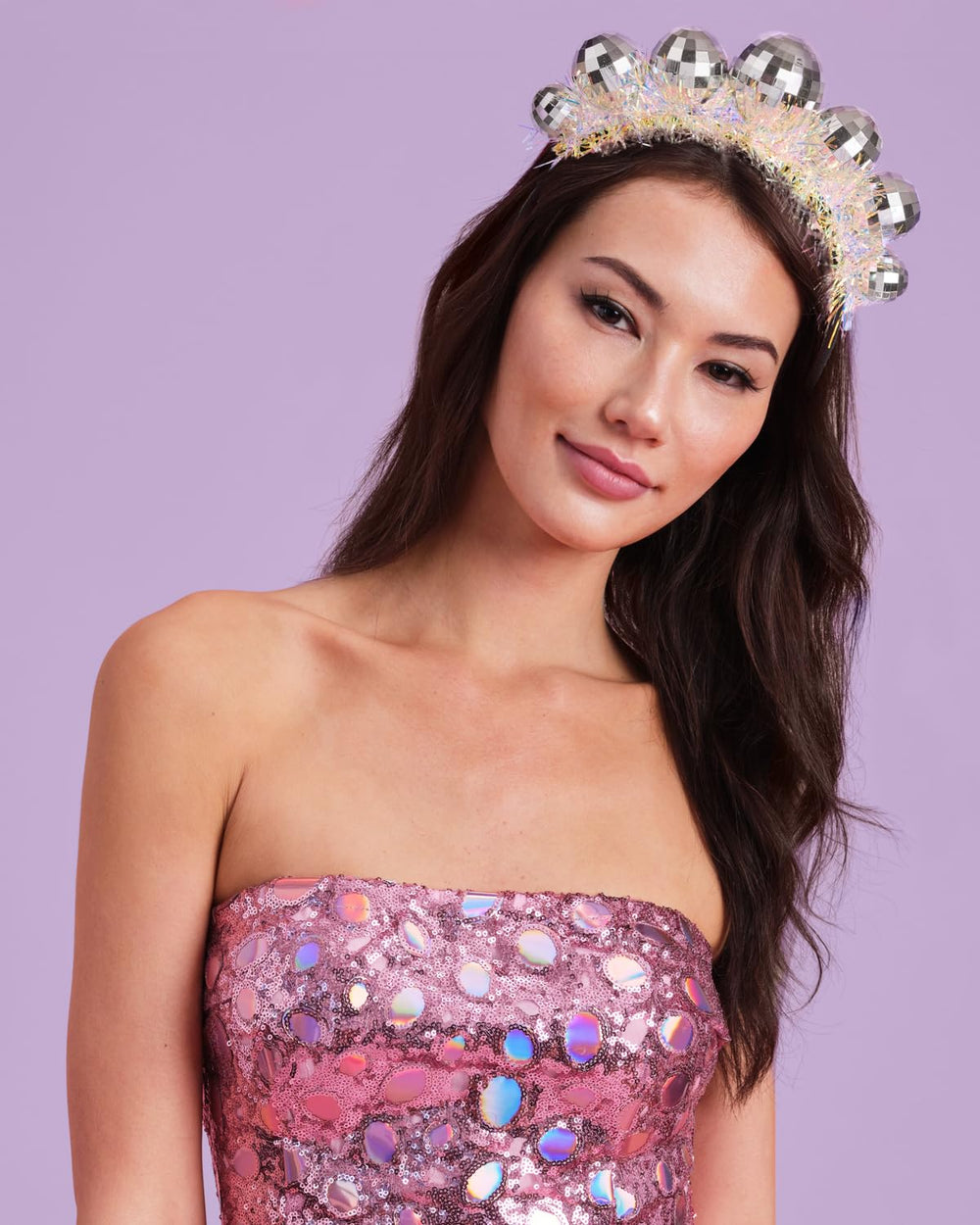 xo-fetti disco ball headband reflects light on the dance floor