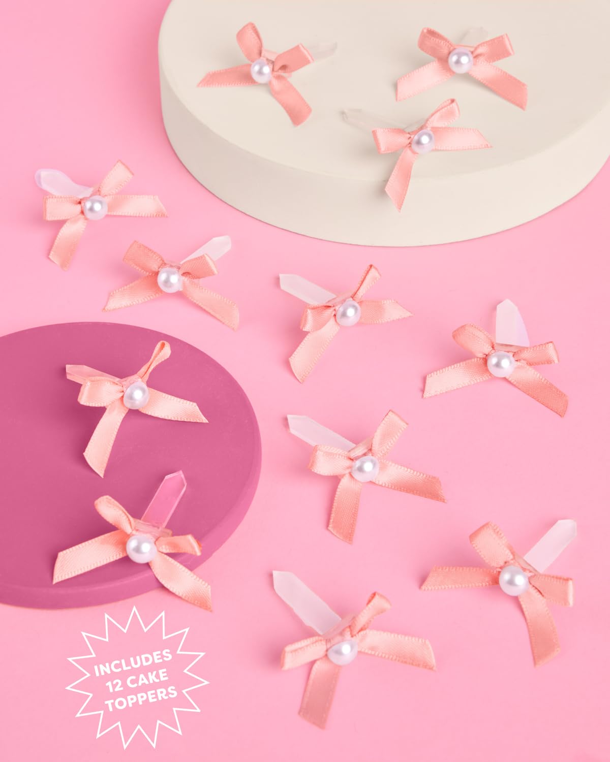 xo Fetti mini pink bows with pearls on a wedding dessert table
