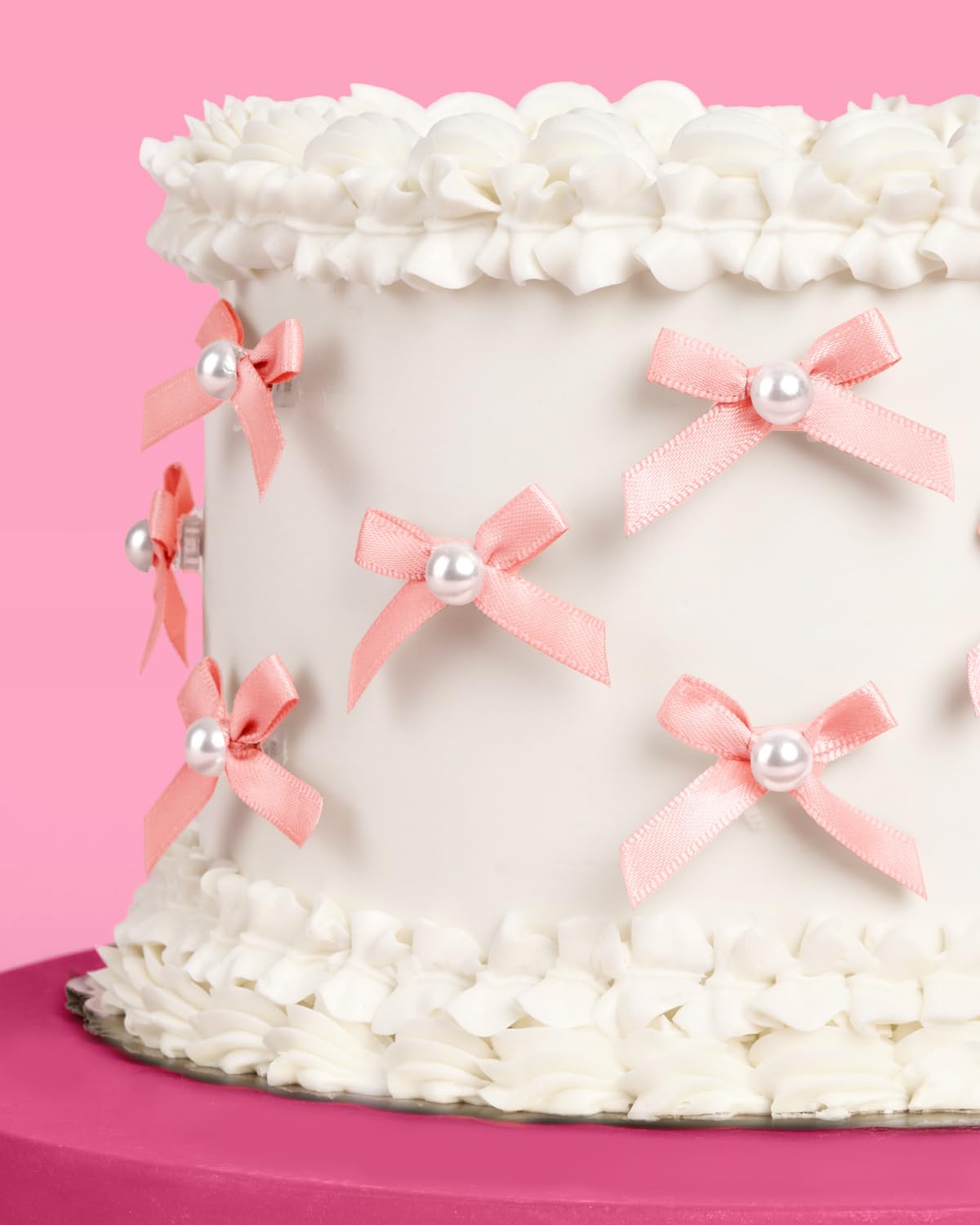 xo Fetti pink bow pearl toppers with clear spikes for easy insertion