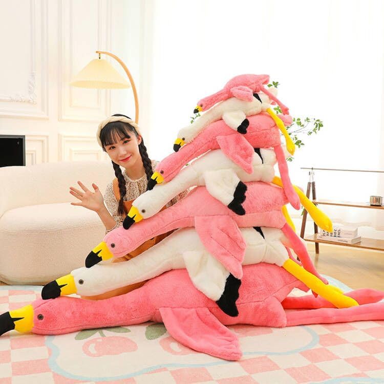 XQEYNT Pink Flamingo Plush Pillow on sofa for quick naps and relaxation