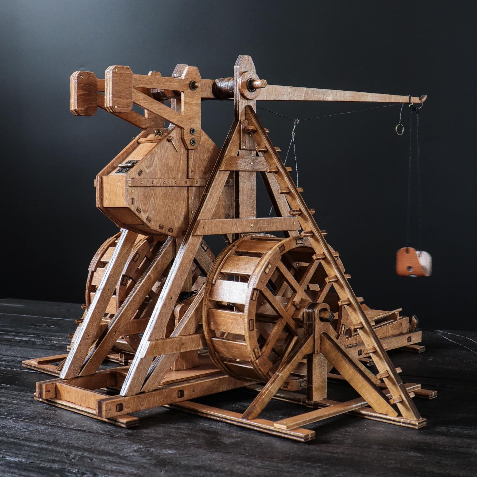 YAQUMW Trebuchet arm and counterweight close-up demonstrates gravity-driven launch concept