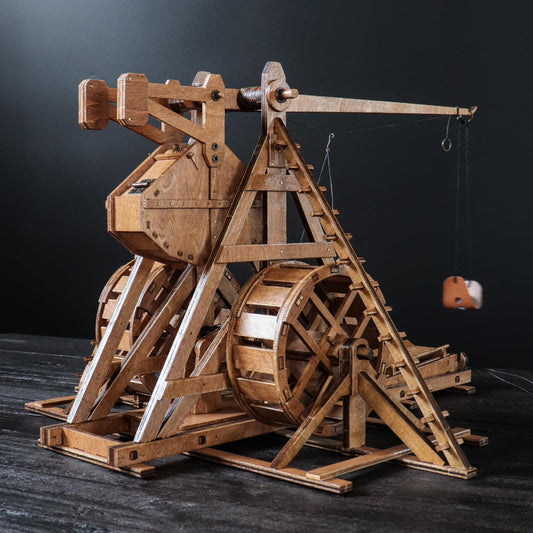 YAQUMW Trebuchet arm and counterweight close-up demonstrates gravity-driven launch concept