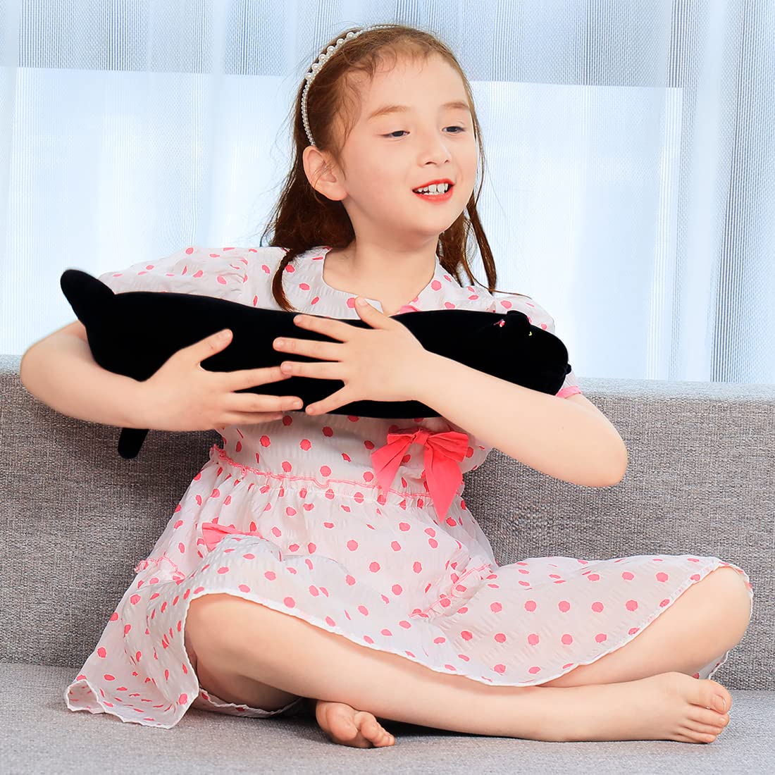 Yeqivo soft plush cat body pillow 130cm in black acts as a comforting sleep companion.