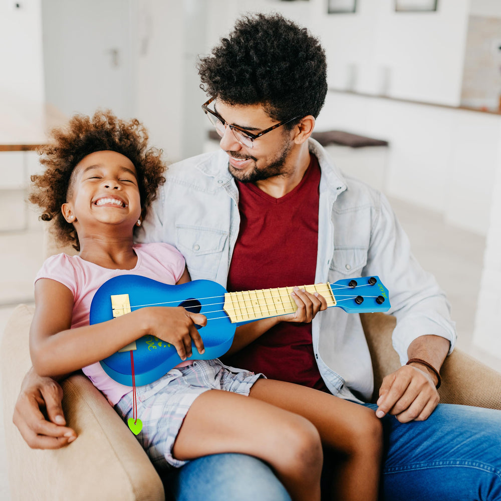 YEZI Kids Ukulele blue side view shows lightweight, easy grasp for small hands.